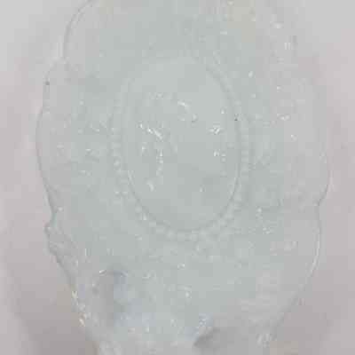 Milk glass tray with woman's profile embossed