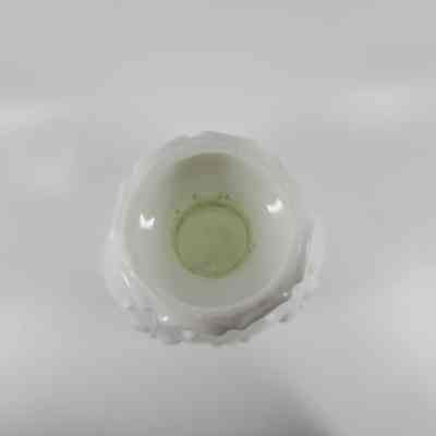Top-down view of milk glass bottle showing scratches inside neck