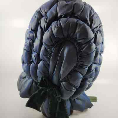 Back of bonnet with green ribbon