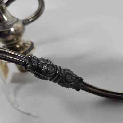 Engraving on the arm of the candelabrum