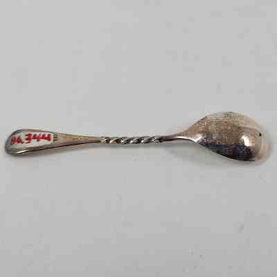Back of silver demitasse spoon