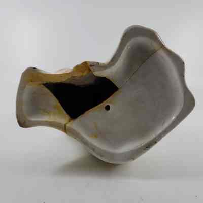 Bottom of King Charles Spaniel figurine with missing piece