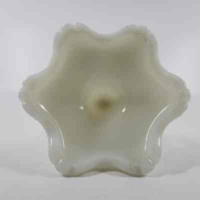 Bottom of white milk glass candlestick