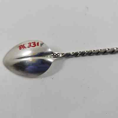 Engraving with "STERLING" on back of spoon