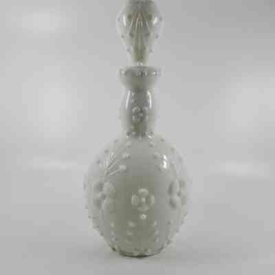 White milk glass bottle with floral sprays with stopper (2015.007 D)