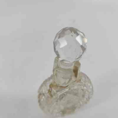 Damage to neck of bottle with repairs