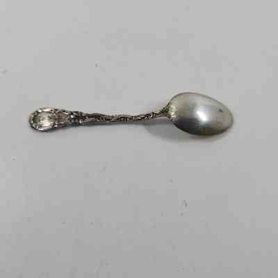 Back of silver demitasse spoon