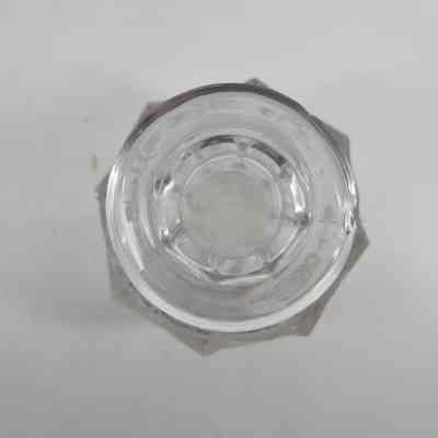 Top down view of glass cologne bottle