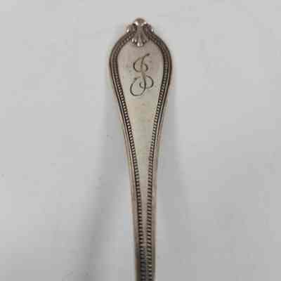 Monogram of "J" on scalloped handle