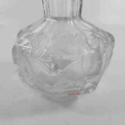 Floral engraving on cologne bottle