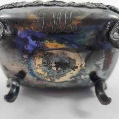 Bottom of toothbrush holder with makers mark