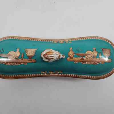 Top down view of soap dish with pottery painted on lid