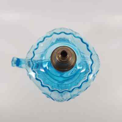 Top-down view of blue glass oil lamp