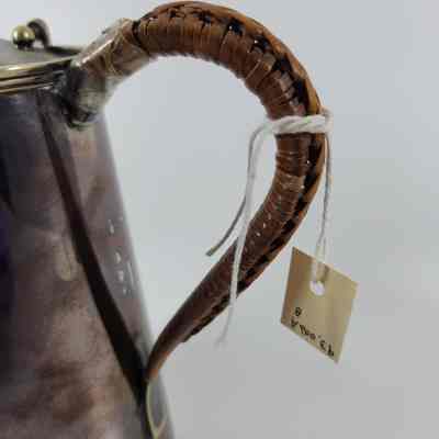 Wooden handle covered in woven ratten
