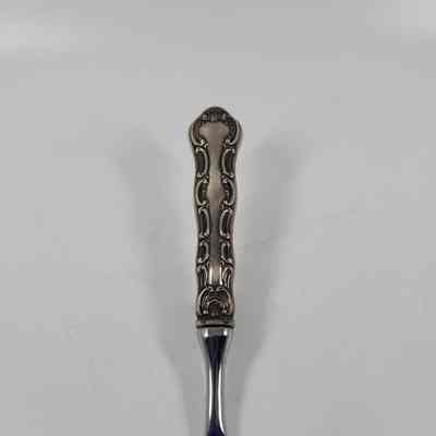 Handle with scroll work egnraving
