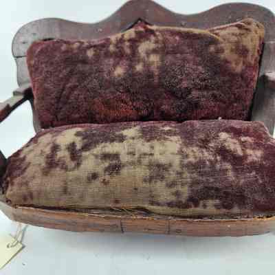 Velvet upholstery worn and faded in color