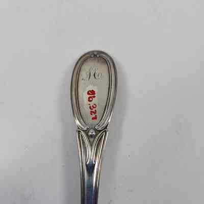 Monogrammed "M" on the back of the handle with the accession number
