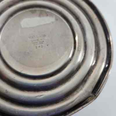 Engraving on bottom of candlestick "Wallace sterling cement filled reinforced 240."