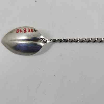 Engraving with "STERLING" on back of spoon