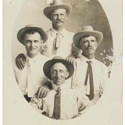 Portrait of four men in hats
