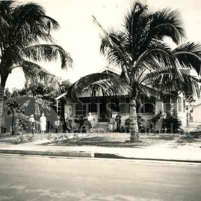 View of home with family in front