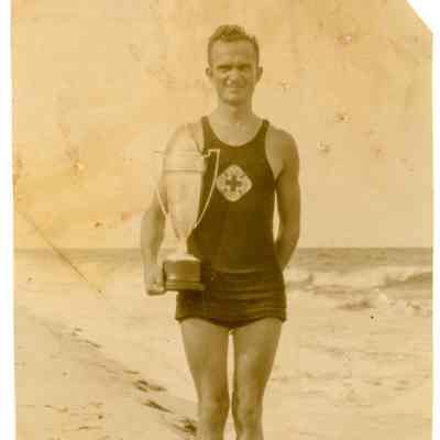 August with a swimming trophy
