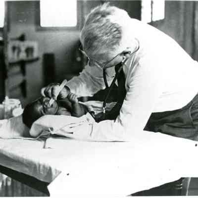 Housing Authority Doctor Examining an African-American Baby