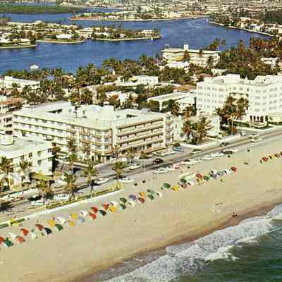 Airview of the beach with the hotel row in the background and Intracostal Waterway.