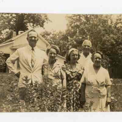 August Jr. and family in a yard