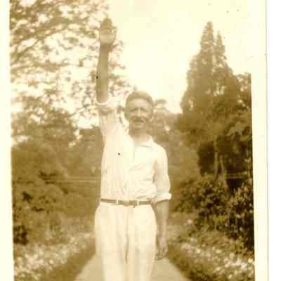 Unknown Man in garden waving