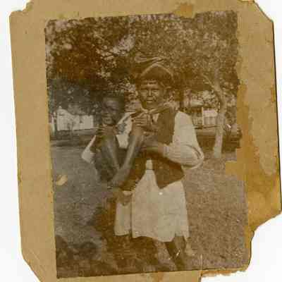 Seminole Indian Man and African-American Boy at Stranahan Camp?