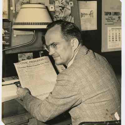 August Burghard Jr. reading the Civic Progress c.1940