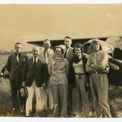 People in front of an airplane