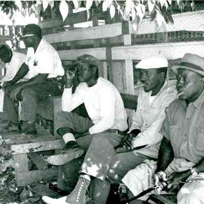 Five African-American Men Sitting on Benches c.1964