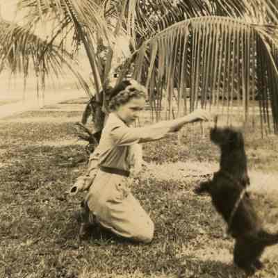 Jacqueline Burghard playing with a dog in Fort Lauderdale.