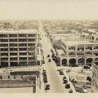 Unfinished building (future Governor's Club Hotel) and Pioneer Department Store