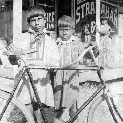 Seminole Boys with Bicycle at Stranahan Trading Post, late 1890s.
