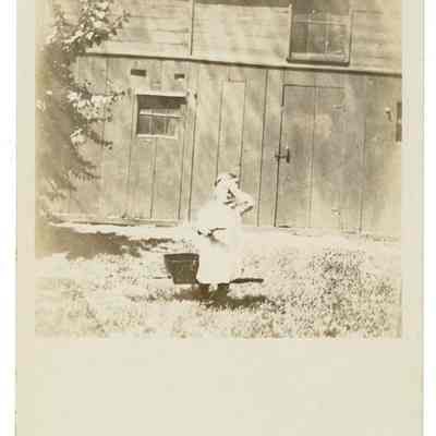 Child in front of building