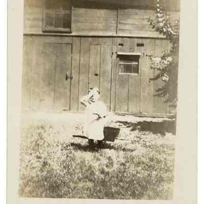 Child in front of building