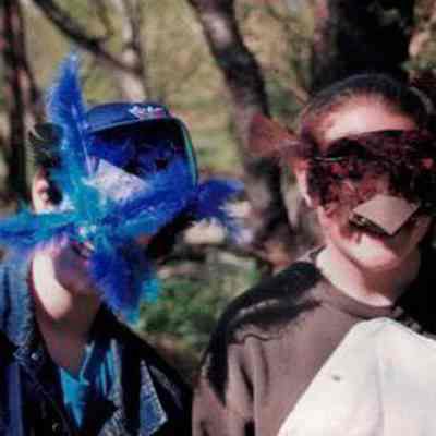 Volunteers pose in masks for theater performance