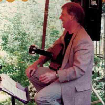 Musical performer under Breakfast tent