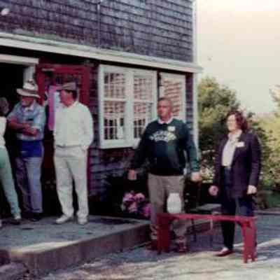 Volunteers welcome attendees outside Barn