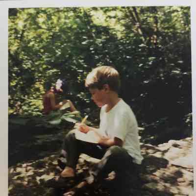Camper sketching on the trail