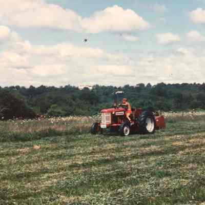 Volunteer mowing the North Field