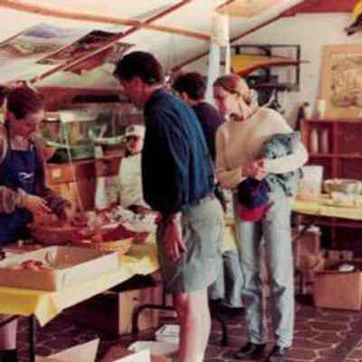 Community members check out pastries in Education Shed