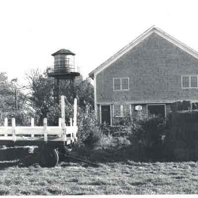 Water Tower & Barn with hay stacks