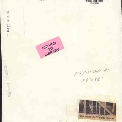 Info on back of photo of hands of inmate at Waupun prison