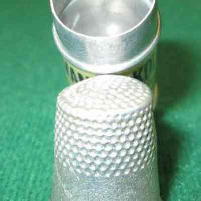 Container with thimble shaped cover/tubular in shape