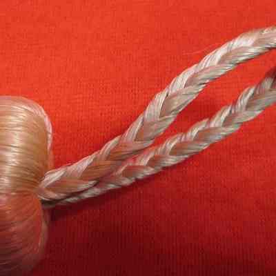 Braided hook or handle on wisk broom