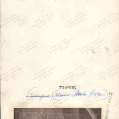Info on back of photo of solitary confinement cell.